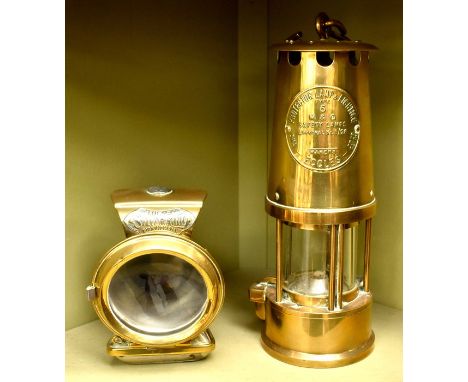 An Eccles Miners Lamp in brass plus a Jos Lucas "Silver King" Bicycle Light, made in Birmingham, with faceted Green stones. (