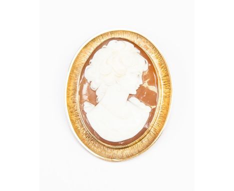 A 9ct gold mounted cameo brooch, textured surround, size approx.&nbsp; 55mm x 45mm, total gross weight approx. 18.4gms&nbsp;