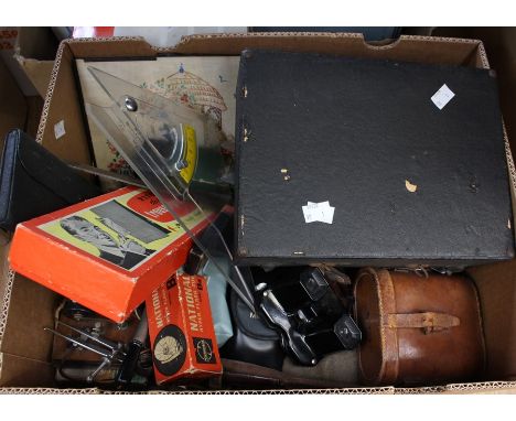 A collection of cameras, binoculars, measuring instruments and other scientific instruments