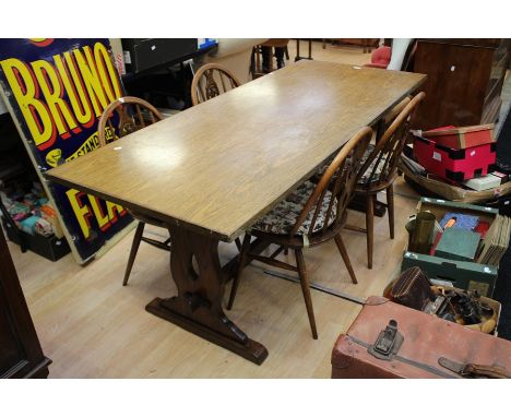 A set of four Ercol elm and beech stick back chairs, a dining table with later top, a corner cabinet and matching china cabin