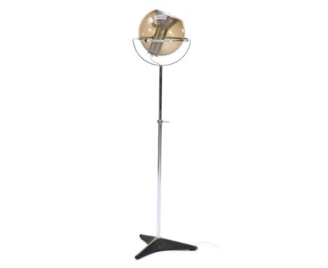 A Vintage Floor Standing Lamp, designed by Frank Ligtelijn for Raak, with a smoked glass circular shade, raised on an adjusta