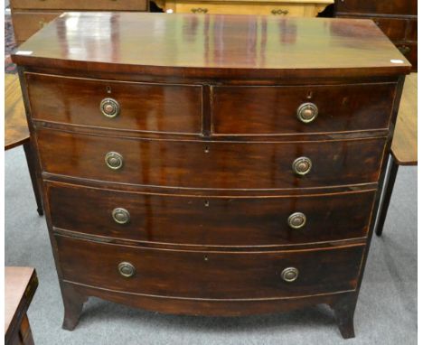 A George III mahogany bow front four height chest of drawers 