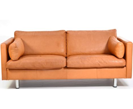 A 1970s Danish Brown Leather Two Seater Sofa, with squab cushions and square form armrests, raised on polished metal tubular 