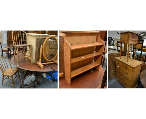 A pair of oak Windsor style chairs, a pine hanging shelf, a pine bedside, two toilet mirrors, a pine four height chest of dra
