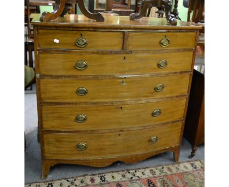 A George III mahogany bow front five height chest of drawers