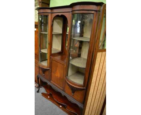 An Edwardian checkered string inlaid mahogany display cabinet, the central oval mirror within a recess above a cupboard door,