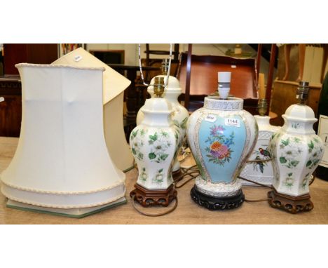 A group of six modern ceramic table lamps
