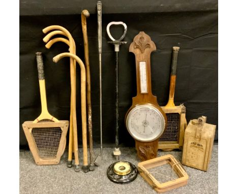 An Aneroid barometer;  another;  old tennis rackets;  Esso Blo paraffin can; walking sticks;   etc 
