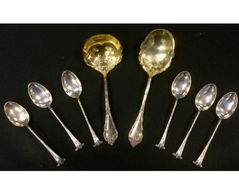 A Sterling silver gilt cream spoon and ladle;  a set of six silver coffee spoons 