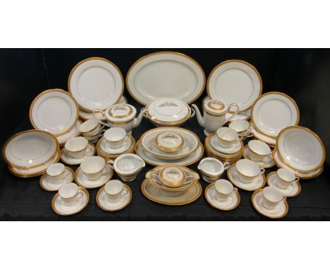 A Noritake dinner, tea and coffee service, for eight, banded in gilt, 