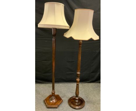 An oak standard lamp, fluted column, c.1930;  another (2) 