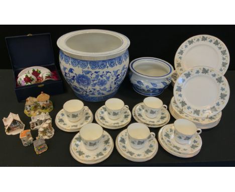 A large blue and white jardiniere, 34cm diam;  another, smaller, 23cm diam;  a tea service, for six;  Lilliput cottages;  a J