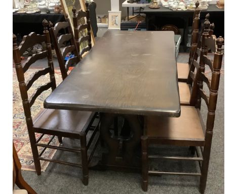 A mid 20th century 'trestle dining table and six ladder back chairs 