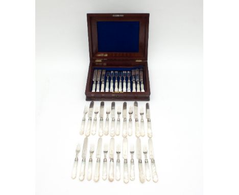 A set of eighteen Victorian mother-of-pearl handled silver dessert knives and forks, HA, Sheffield 1867, crested