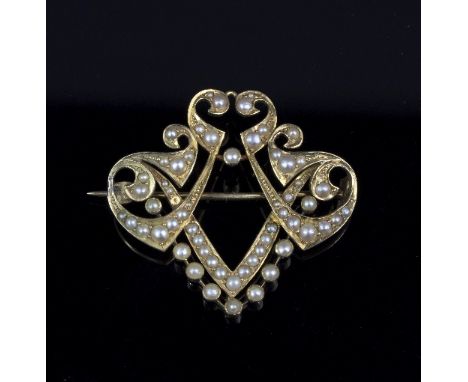 A Victorian half pearl set brooch of shield shape, cased