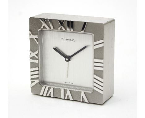 A bedside alarm clock by Tiffany & Co., the silvered dial signed Tiffany & Co., the frame with raised Roman numerals, 7cm wid