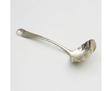 An Irish silver sauce ladle, marks illegible, with shell bowl and engraved stemsauce ladle