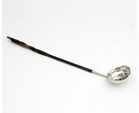 A Scottish silver toddy ladle, C & S, Edinburgh 1807, of circular form with twisted whalebone handle, 36.5cm long