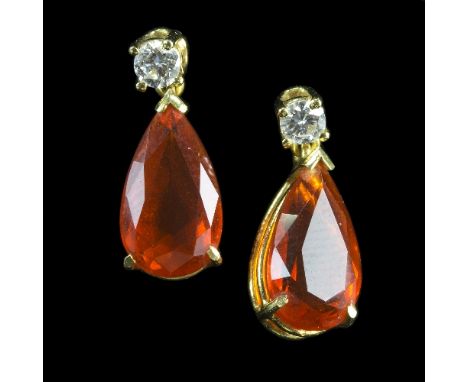 A pair of fire opal and diamond pendant earrings, each with a pear shaped fire opal beneath a small diamond, set in 18ct yell