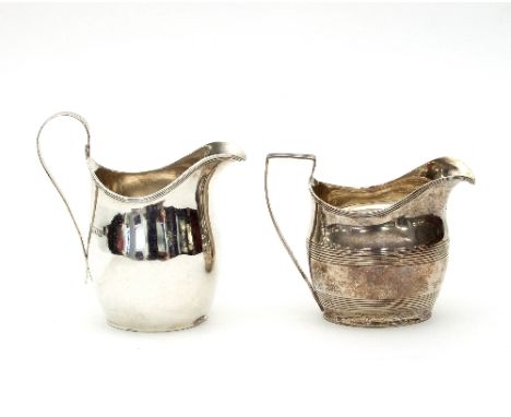 A George III silver cream jug, London 1807, and another London 1908, both of helmet shape, approximately 250gm