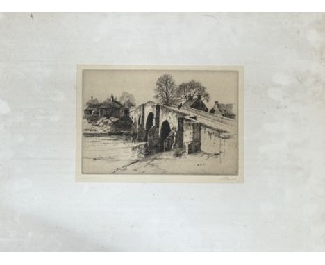 A.P Thomson, Riverbank with bridge and town to background, etching, signed pencil bottom right, in a glazed frame. (14.5cmx21