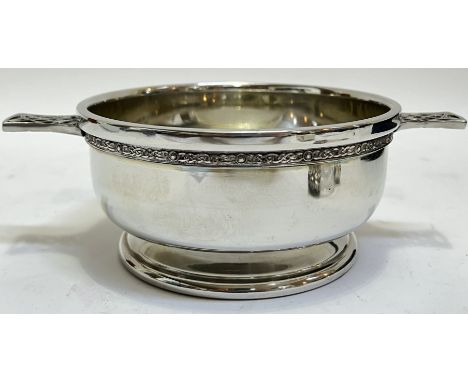 A Scottish Piper Pewter bowl in the form of a quiach (h- 8cm, w- 22cm), decorated wit Celtic knot motifs, together with a hip