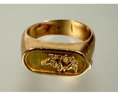 A Egyptian Pharaoh yellow metal seal style ring with L x 1.8cm R 4.83g&nbsp;