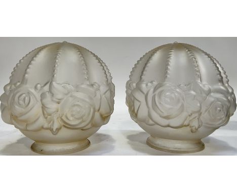 A pair of frosted glass lampshades relief moulded with roses&nbsp; (h- 15cm, w- 15cm), together with another lamp glass lamp 