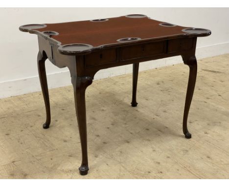 An early 20th century mahogany card table in the Georgian style, the lobed fold over top opening to reveal a baize lined play