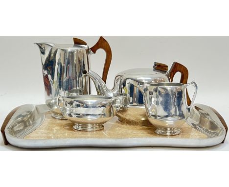 A 1950s aluminium and sycamore Picquot Ware tea/coffee set including two pots (largest h- 21cm), a sugar basin, a milk jug an