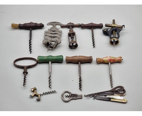 Eleven various corkscrews;&nbsp;together with six antique button hooks. 