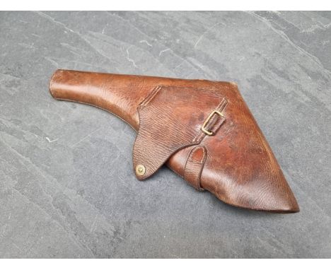 A vintage tan leather pistol holster.&nbsp; 