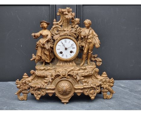 A spelter mantel clock,&nbsp;37cm high; together two slate mantel clocks, largest 23.5cm high, (each lacking pendulum). (3) 