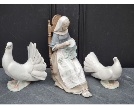 Three Lladro figures, largest 27.5cm high.&nbsp; 