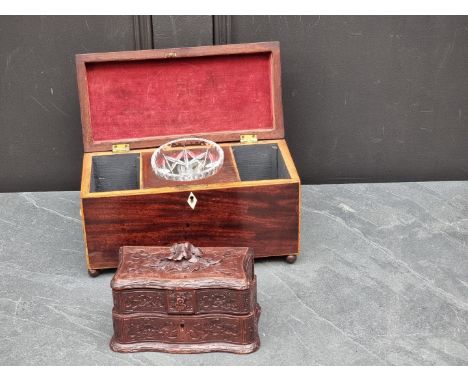 An early 19th century mahogany and inlaid tea caddy,&nbsp;with bone escutcheon, 30.5cm wide; together with another small carv