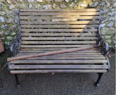 An antique cast iron garden bench, 106.5cm wide. 