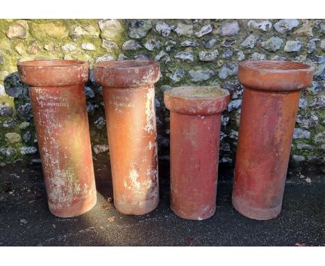 A set of three stoneware chimney pots,&nbsp;inscribed 'Bourne Valley Pottery, Sharp Jones &amp; Co, Poole', 84cm high; togeth
