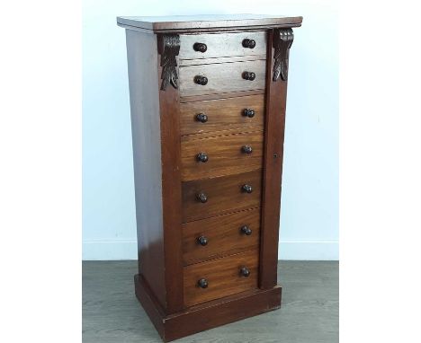 VICTORIAN MAHOGANY WELLINGTON CHEST,with seven graduated drawers, turned handles with right hand locking bar on plinth base, 