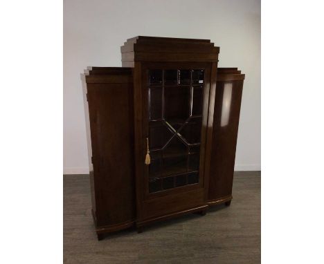 DANISH MAHOGANY BREAKFRONT BOOKCASE,of Art Deco design, with stepped cornice over a central astragal glazed door with bevelle