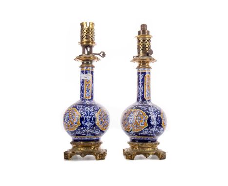 PAIR OF 19TH CENTURY FRENCH FAIENCE VASES IN THE MANNER OF GIEN CONVERTED TO OIL LAMPS,the bodies with transferred mask and s