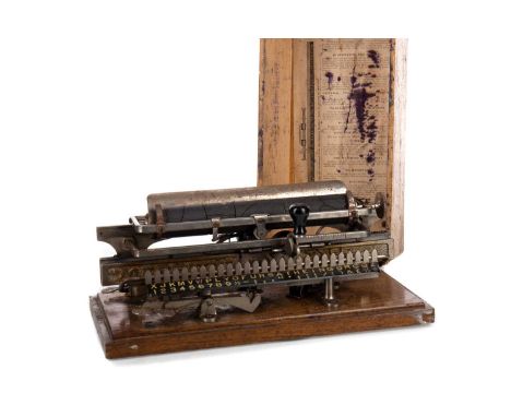LATE 19TH CENTURY MERRITT TYPEWRITER,United States Pat Feb 11th 1890, stamped no. 1234 10355 to oblong oak base, 31.1cm wide,