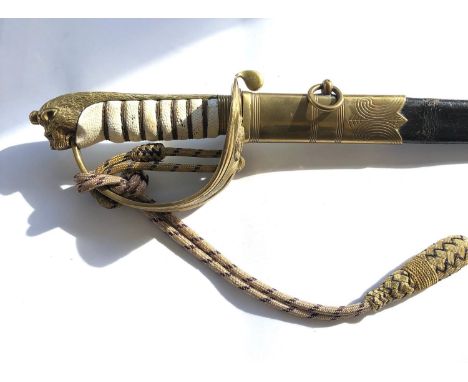 Antique Navy Officer's sword by Manton &amp; Co, with etched blade, brass bowl  and original brass-mounted leather scabbard 