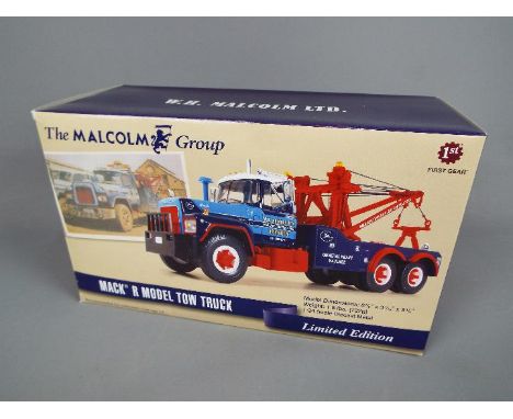 First Gear - A boxed Limited Edition 1:34 scale 'The Malcolm Group' Mack R Model Tow Truck by First Gear. The model numbered 