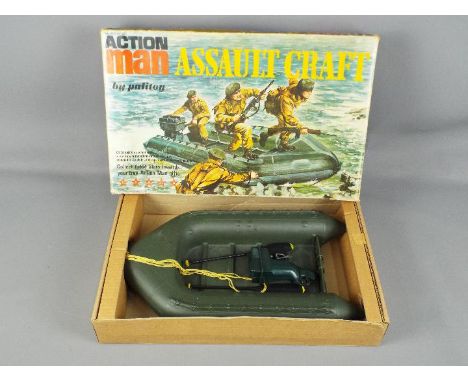 Palitoy - A boxed vintage Palitoy 'Action Man' Assault Craft, containing Craft, rope, 2 paddles and a motor. Overall the craf