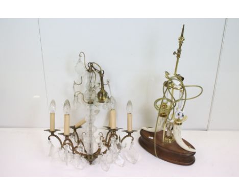 A brass and glass six branch ceiling light with glass droplet decoration together with a large table lamp. 