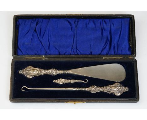 A fully hallmarked sterling silver button hook and shoe horn set in original fitted case.