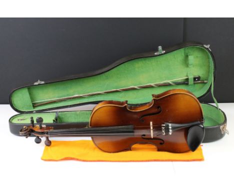 A vintage violin with inner label marked Antonius Stradivarius Cremonensis, complete with bow and hard case. 