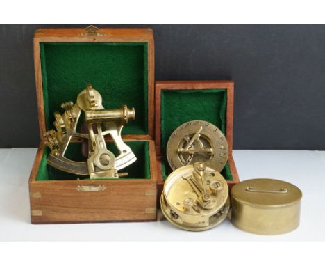 A contemporary brass sextant within a wooden case together with a compass and clinometer. 
