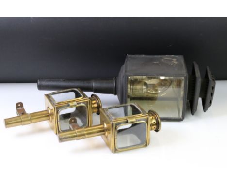 An antique carriage lamp with bevelled glass panels together with a pair of smaller brass examples. 