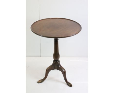 George III mahogany tripod table, one pad foot chewed, approx. 56cm diameter 